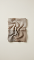 Earth linen scarf, Hero angle is 3/4 slightly above tabletop for depth and context; items grouped naturally as if mid-use...
